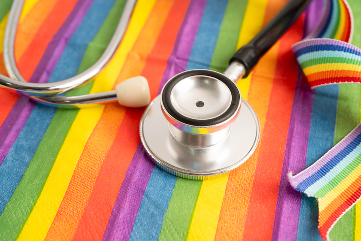 Stethoscope on LGBT rainbow flag, rights and gender equality.