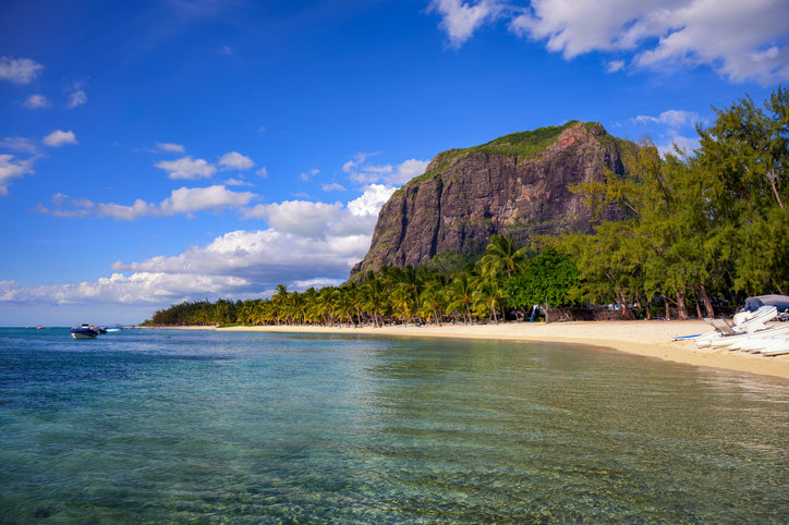 Tropical beach with boats, palm trees, and Le Morne Brabant mountain, Mauritius, Africa, Travel, Safety