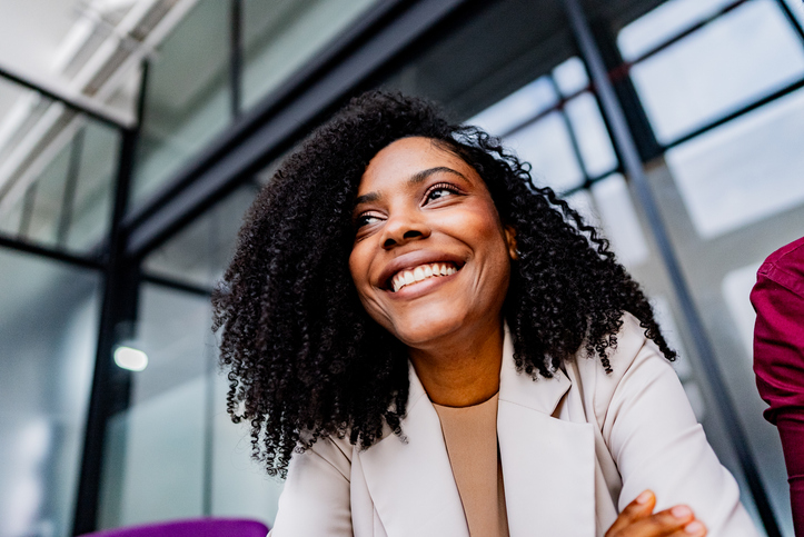 Mid adult businesswoman contemplating at office