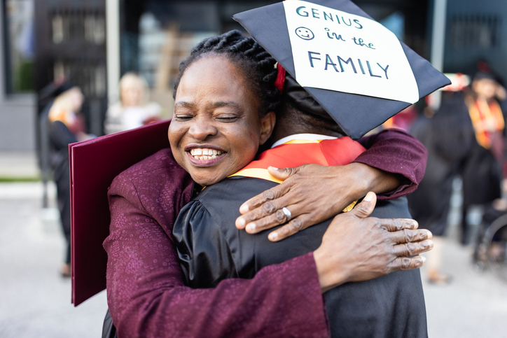 Graduation Day Hug: Celebrating Achievement with Family