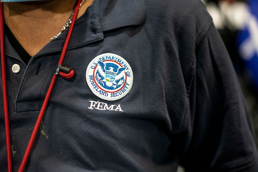 ESTERO, FL - OCTOBER 3: FEMA worker Jean Fequiere with logo on