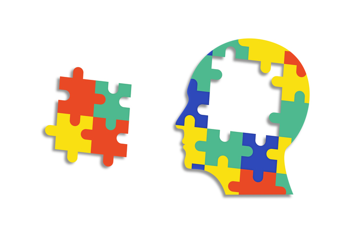 Autism Awareness Puzzle Pieces Forming a Human Head